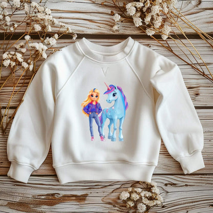 Bügelmotiv Mädchen mit Einhorn in Blau‑ und Pastelltönen