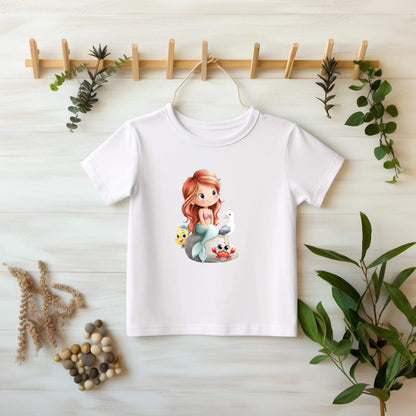 Bügelmotiv Meerjungfrau mit Fisch, Möwe und Krabbe auf Felsen