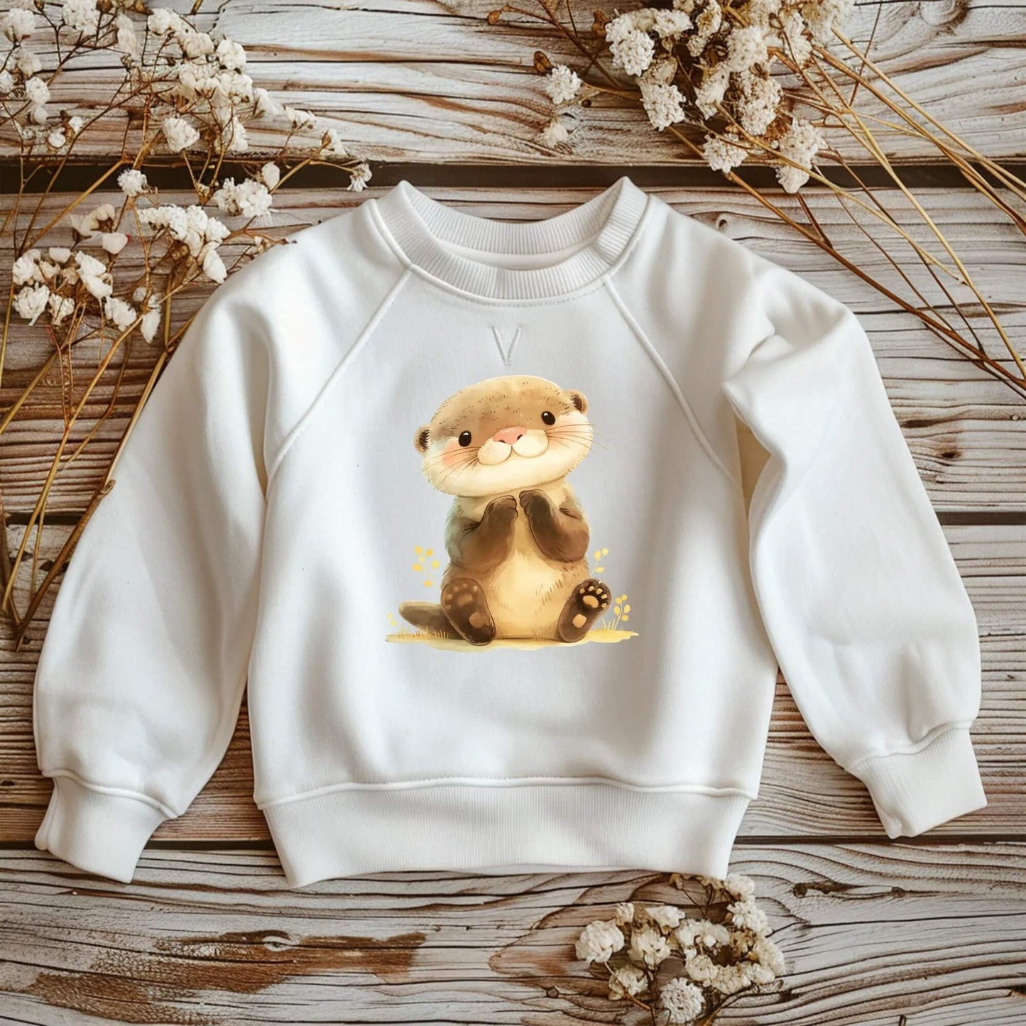Bügelmotiv Otter mit fröhlichem Gesicht und kleinen Pfoten