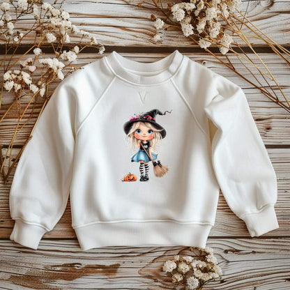 Buegelmotiv Maedchen als Hexe mit Blumenhut und Halloween Deko