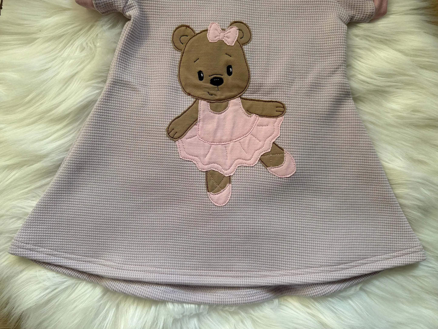 Waffelstrick Kleid mit rosa Bündchen für Mädchen

