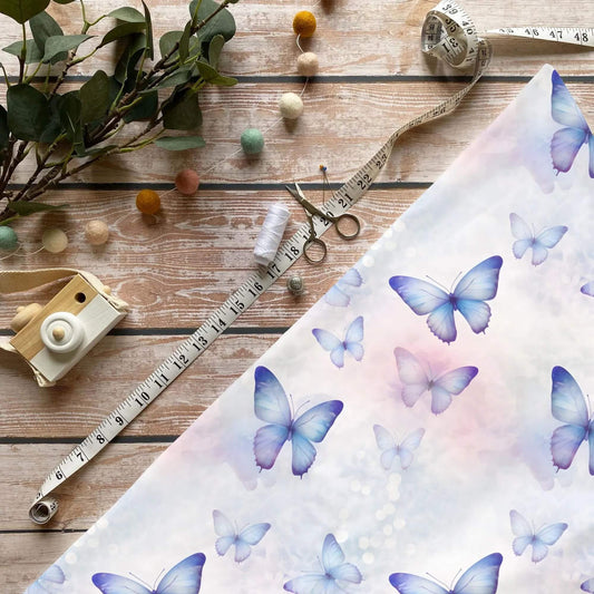 Kinderstoffe Meterware Schmetterlingszauber Aquarell Blau Lila Baumwolle