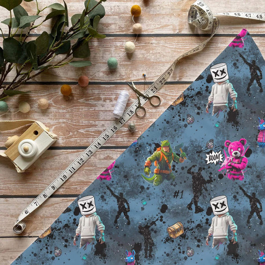 Gaming Vibes Baumwollstoff mit Fortnite-Motiven und Comic-Elementen auf blauem Hintergrund