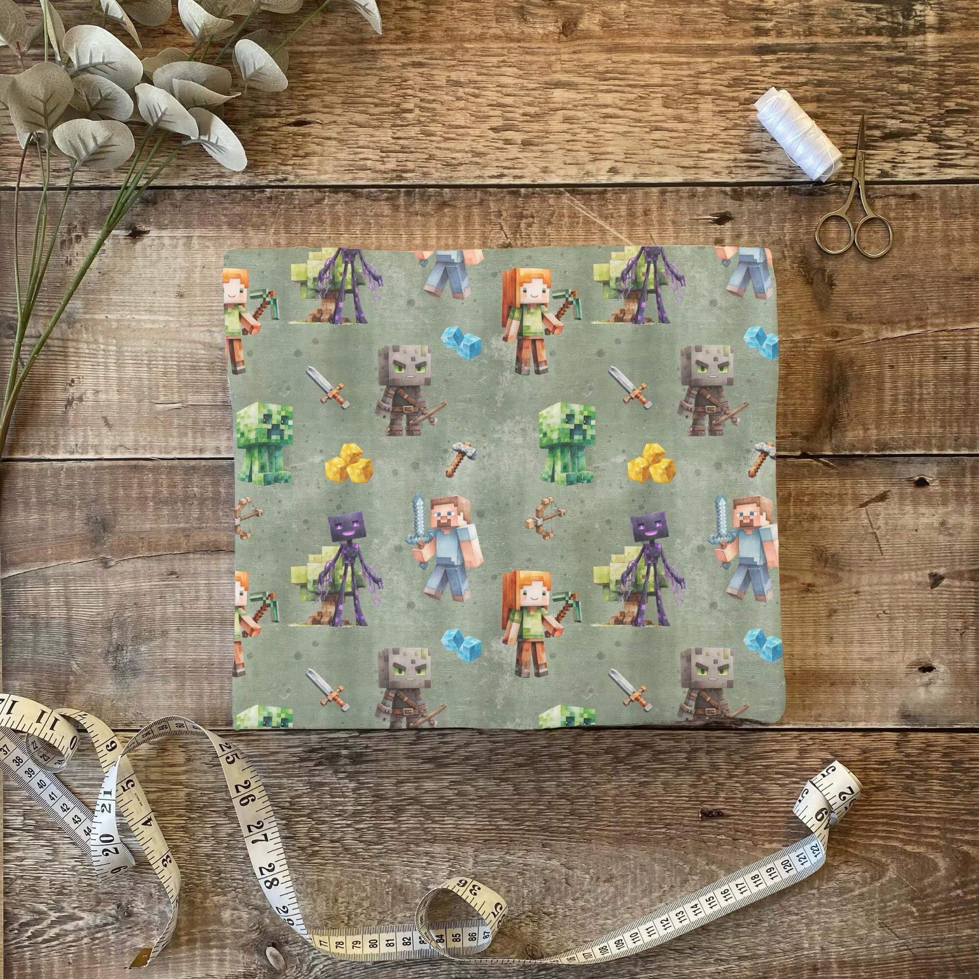 „Jersey Kinderstoff mit Pixelmotiv – OEKO-TEX zertifiziert & liebevoll illustriert“